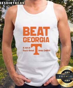 Person wearing Awesome Tennessee Volunteers tank top at Guss Good Times Deli after beating Georgia, celebrating victory.