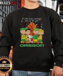 Alt Text: Awesome Peanuts character Oregon Ducks sweatshirt for the holiday season - perfect for fans and festive cheer.