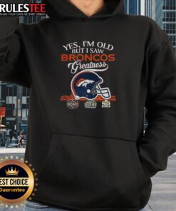 Alt Text: Old fan wearing a Denver Broncos hoodie with Super Bowl helmet and skyline, celebrating team greatness.