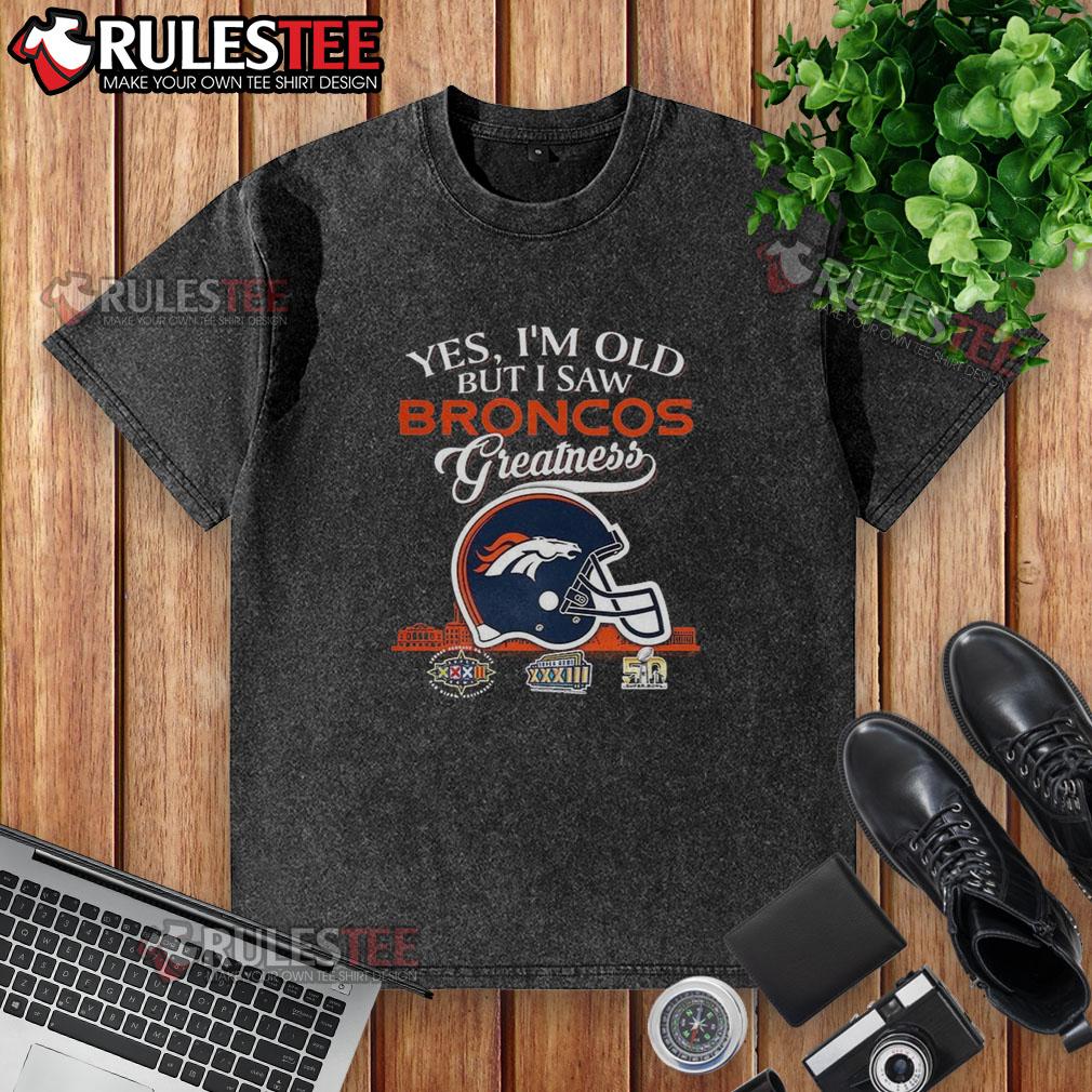 Awesome Yes I'm Old But I Saw Denver Broncos Greatness Super Bowl Helmet Skyline Washed T-Shirt Vintage 'Awesome Yes I'm Old' Denver Broncos Super Bowl helmet t-shirt with skyline design, perfect for fans.