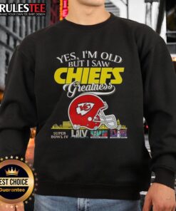 Vintage sweatshirt featuring Kansas City Chiefs Super Bowl helmet and skyline, celebrating NFL greatness for fans.