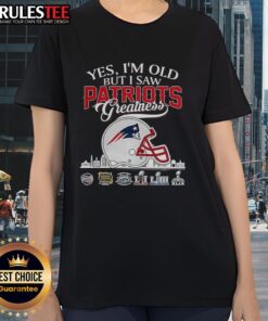 Womens tee featuring New England Patriots Super Bowl helmet and skyline, perfect for fans celebrating team greatness.