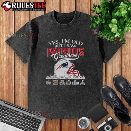 Alt Text: Washed t-shirt featuring 'Awesome, Yes I'm Old' and New England Patriots Super Bowl helmet skyline design.