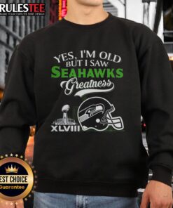 Alt Text: Seattle Seahawks Super Bowl helmet graphic on an 'Awesome Yes I'm Old' sweatshirt with skyline design.
