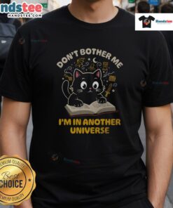 Cute cat graphic on 'Don't Bother Me I'm In Another Universe' T-shirt, perfect for cat lovers and quirky fashion.