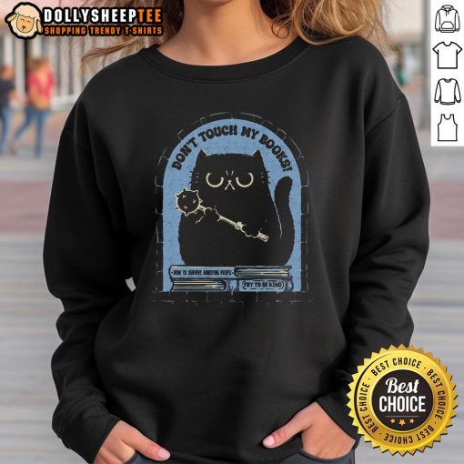 Cute cat on a 'Don't Touch My Books' sweatshirt, showcasing a playful feline design perfect for cat lovers.