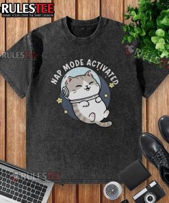 Cute cat napping in zero-gravity mode on a comfy washed t-shirt, perfect for cat lovers and cozy moments.
