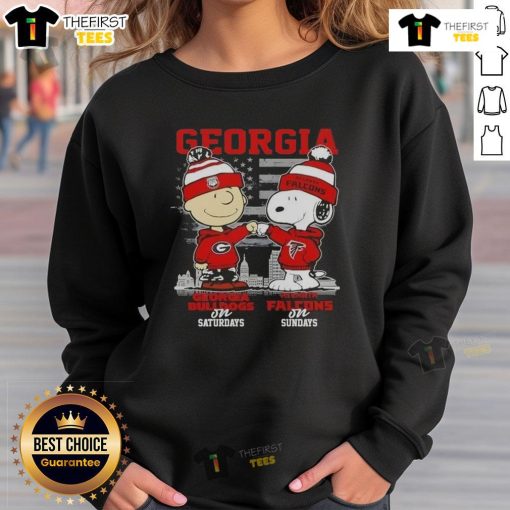 Alt Text: Cute Charlie Brown Georgia Bulldogs sweatshirt featuring Snoopy and Atlanta Falcons skyline for game day style.