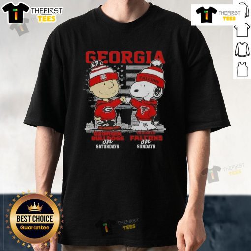 Charlie Brown and Snoopy in Georgia Bulldogs and Atlanta Falcons shirts against a skyline background. Perfect game day tee!