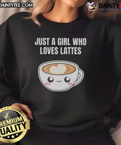 Cute girl in a kawaii sweatshirt enjoys lattes at a cafe, showcasing her love for coffee and espresso.