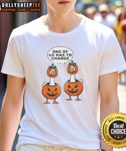 Cute Halloween pumpkin costume T-shirt featuring geese and the phrase 'One Of Us Has To Change' for festive fun.