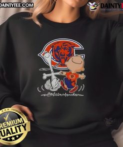 Alt Text: Cute Peanuts Snoopy and Charlie Brown Chicago Bears football sweatshirt, perfect for fans of the Peanuts gang.