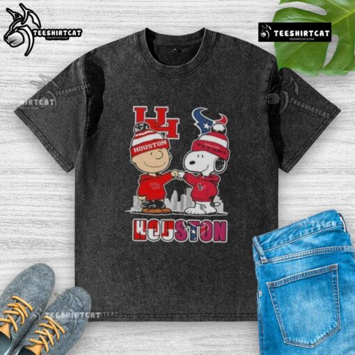 Alt Text: Cute Snoopy and Charlie Brown on a Houston Sports Cougars X Texans skyline washed t-shirt design.
