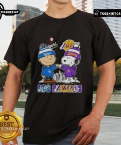 Alt Text: Cute Snoopy and Charlie Brown Los Angeles sports Dodgers X Lakers skyline t-shirt design featuring iconic characters.