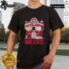 Alt Text: Cute Snoopy and Charlie Brown in Ohio State Buckeyes football gear on a skyline t-shirt design.