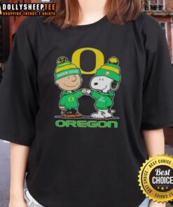 Cute Snoopy and Charlie Brown Oregon Ducks football skyline graphic on a ladies tee shirt, perfect for fans.