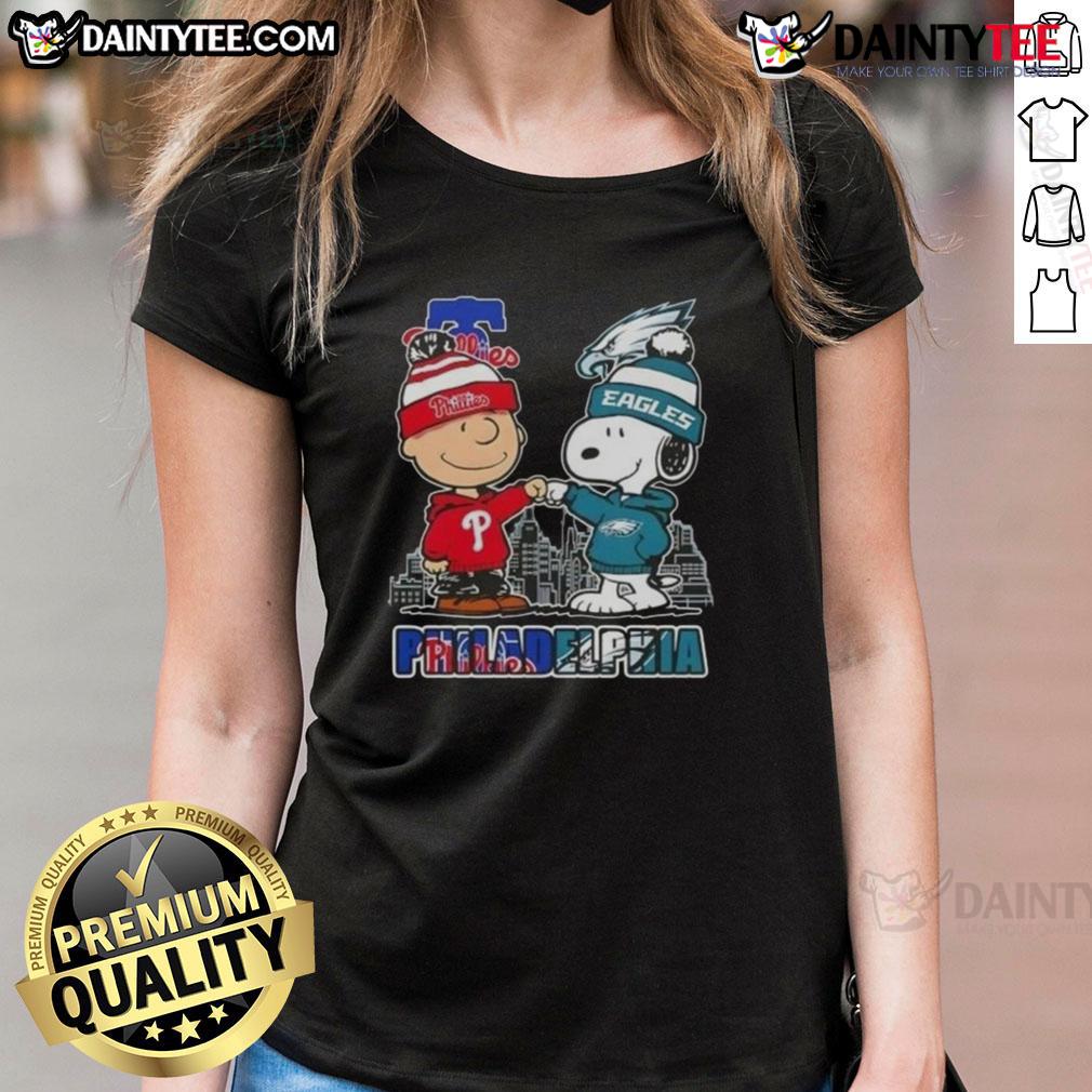 Cute Snoopy And Charlie Brown Philadelphia Sports Phillies X Eagles Skyline Ladies-Tee Cute Snoopy and Charlie Brown in Philadelphia sports gear featuring Phillies and Eagles skyline on ladies tee.