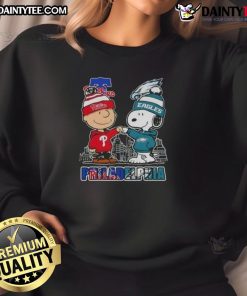 Cute Snoopy and Charlie Brown in Phillies and Eagles sweatshirt with Philadelphia skyline background.