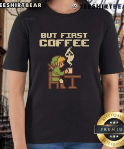 Funny 'But First Coffee' tee featuring retro Zelda pixel art for gamers, perfect for ladies who love gaming fashion.