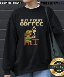 Funny 'But First Coffee' sweatshirt featuring retro gamer pixel art inspired by The Legend of Zelda.