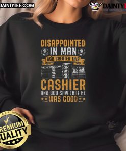 Alt Text: Funny cashier wearing 'God Created This Cashier' sweatshirt, showing a disappointed expression at a customer.