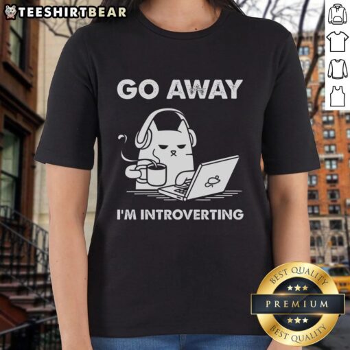 Funny cat graphic on a tee shirt with 'Go Away, I'm Introverting' text, perfect for cat lovers and introverts.