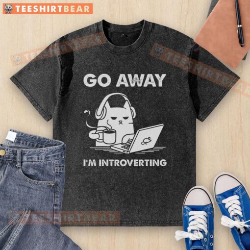 Funny cat on a washed t-shirt with 'Go Away, I'm Introverting' text, perfect for cat lovers and introverts.