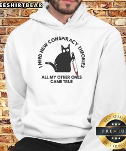 Funny cat hoodie with the text I need new conspiracy theories, all my other ones came true, perfect for cat lovers.