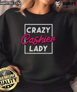 Funny crazy cashier lady in a grocery store wearing a humorous sweatshirt, showcasing retail worker spirit and personality.