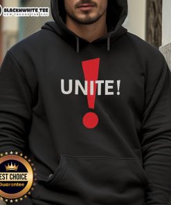 Alt Text: Dominic Fike wearing a funny Unite hoodie, showcasing his unique style and playful personality in a vibrant setting.