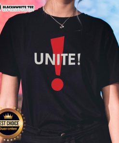 Alt Text: Dominic Fike humorously models a Unite Ladies Tee, showcasing his unique style and playful personality.