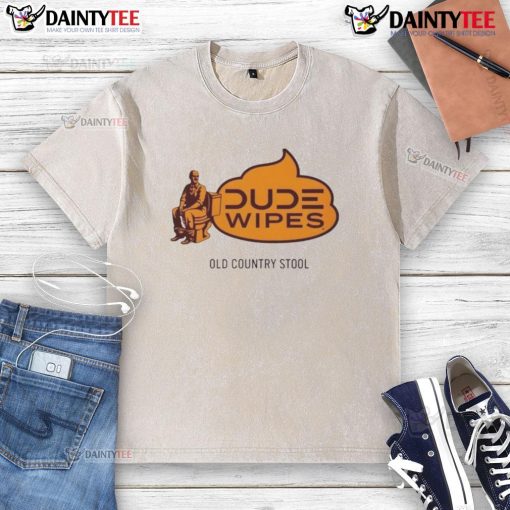 Funny dude wipes an old country stool while wearing a washed t-shirt, showcasing a humorous take on cleaning tasks.