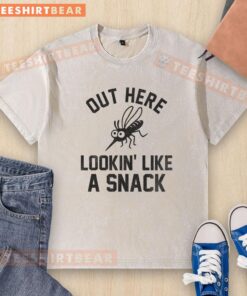 Funny mosquito on a washed t-shirt, humorously looking like a snack, perfect for a lighthearted fashion statement.