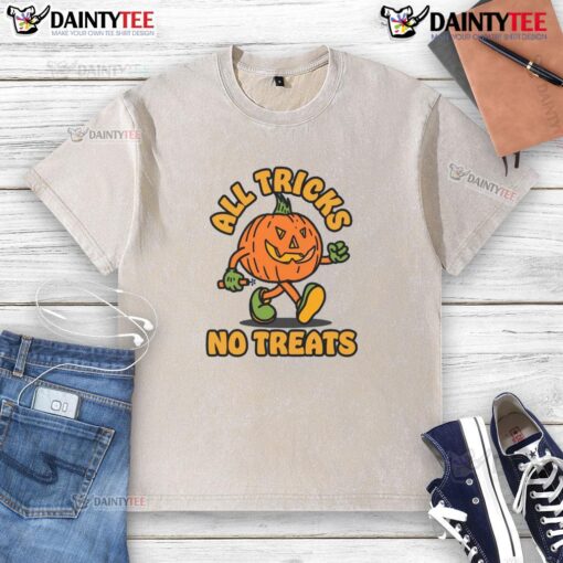 Funny pumpkin graphic on a washed t-shirt for Halloween, featuring 'All Tricks No Treats' design.