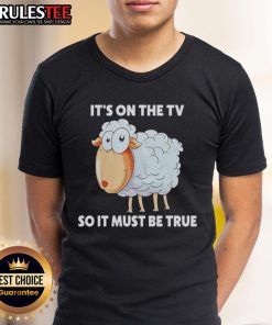 Alt Text: Funny Sheep It's On The TV So It Must Be True T-Shirt featuring a cartoon sheep design for humor lovers.