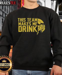 Alt Text: Funny Minnesota Vikings logo sweatshirt that says 'This Team Makes Me Drink', perfect for fans and game day wear.