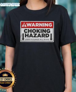 Funny warning label on a ladies tee, highlighting choking hazard and user assumes all risks, perfect for humorous apparel.