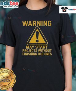 Funny warning tee for ladies: 'May start projects without finishing old ones' - perfect for creative procrastinators.