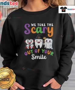 Funny Halloween sweatshirt features 'We Take The Scary Out Of Your Smile' with a playful teeth design for festive fun.