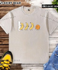 Alt Text: Good Banana Orange Knock Knock washed t-shirt featuring a playful graphic and vibrant colors for casual wear.