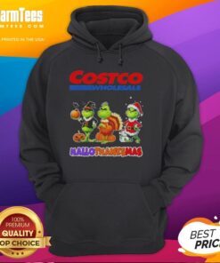 Person wearing a Good Costco Wholesale X Grinch cosplay hoodie for Happy HalloThanksMas celebration, showcasing festive spirit.