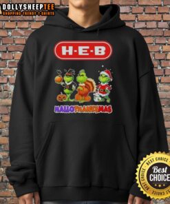 Person wearing a Good H-E-B X Grinch cosplay hoodie for Happy HalloThanksMas, showcasing festive holiday spirit.