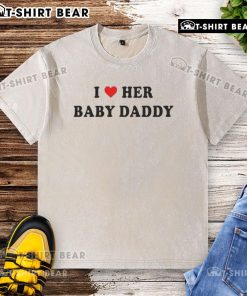 Good I Love Her Baby Daddy washed t-shirt displayed on a hanger, perfect for casual wear and expressing love.