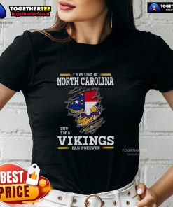 Good I May Live In North Carolina But I'm A Minnesota Vikings Fan Forever ladies tee featuring vibrant team colors.