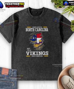 Good I May Live in North Carolina But I'm a Minnesota Vikings Fan Forever washed t-shirt in blue and white.