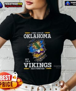 Good I May Live In Oklahoma But I'm A Minnesota Vikings Fan Forever ladies tee showcasing team spirit and style.