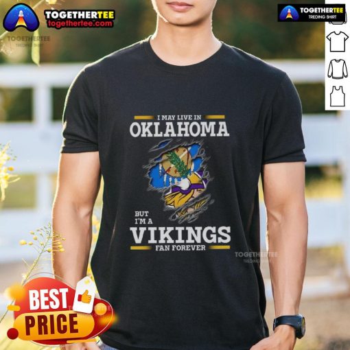 Good I May Live In Oklahoma But I'm A Minnesota Vikings Fan Forever T-Shirt showcasing team spirit and loyalty.