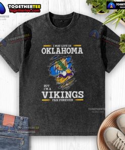 Good I May Live In Oklahoma But I'm A Minnesota Vikings Fan Forever washed t-shirt in vibrant purple and gold.