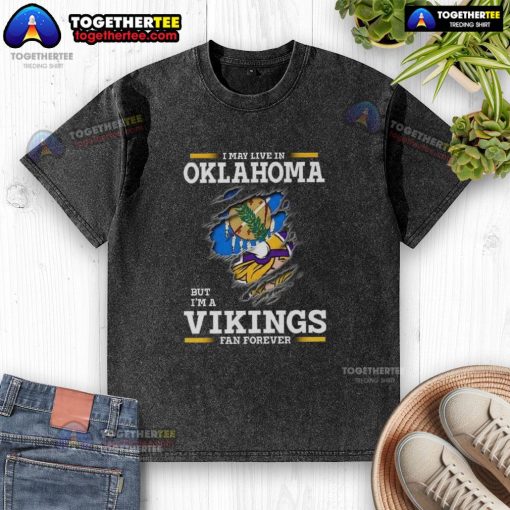Good I May Live In Oklahoma But I'm A Minnesota Vikings Fan Forever washed t-shirt in vibrant purple and gold.