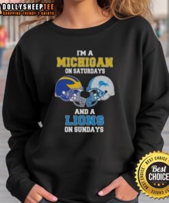 Alt Text: Good I'm a Michigan on Saturdays and a Lions on Sundays football helmet sweatshirt in navy blue and maize colors.
